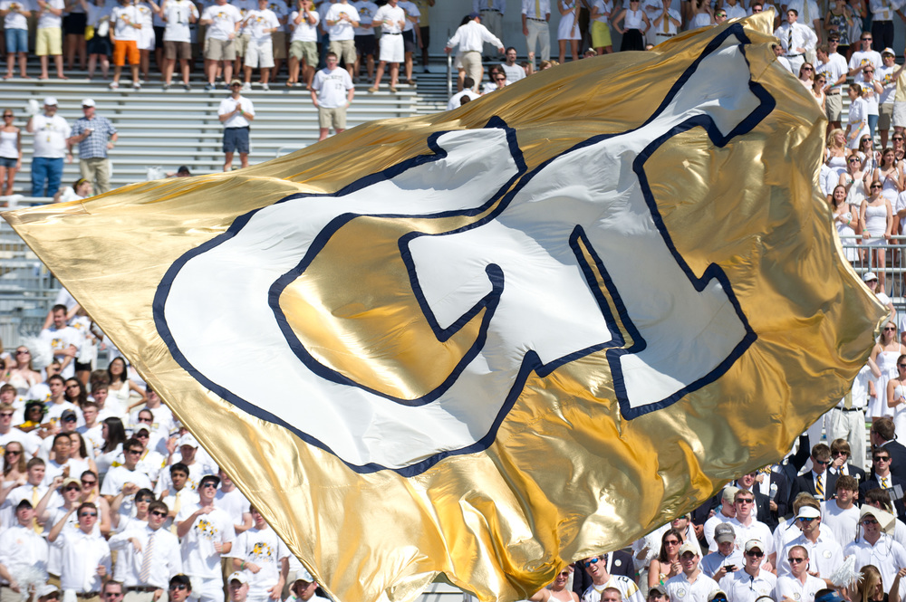 Georgia Tech flag being flown at a football game